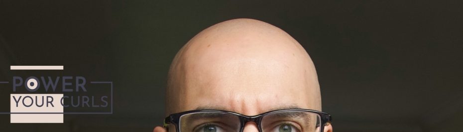 The top of a bald man’s head.
