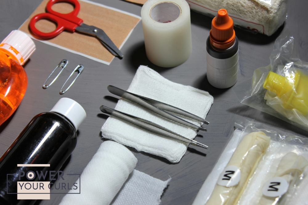 A close up photo of medical tools neatly arranged on a table top.