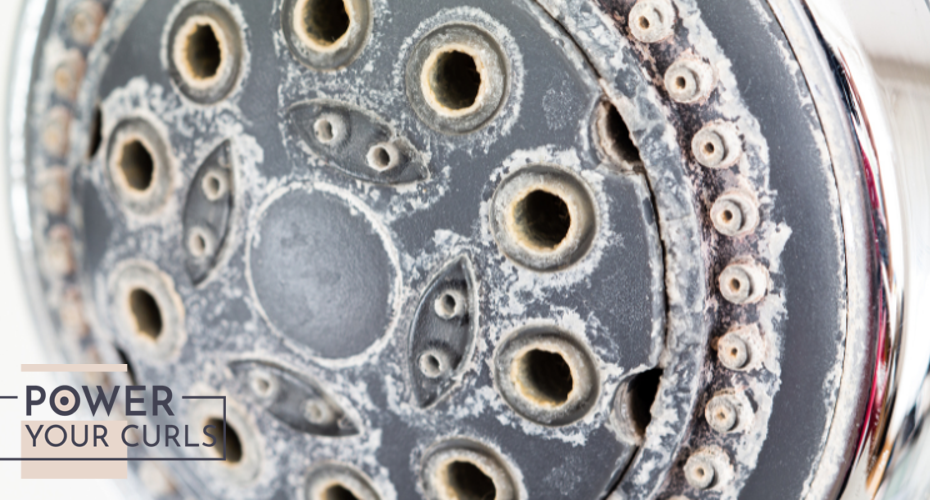 A showerhead caked with limescale