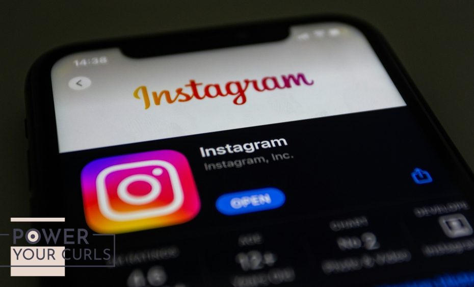 An iPhone displays the Instagram logo.