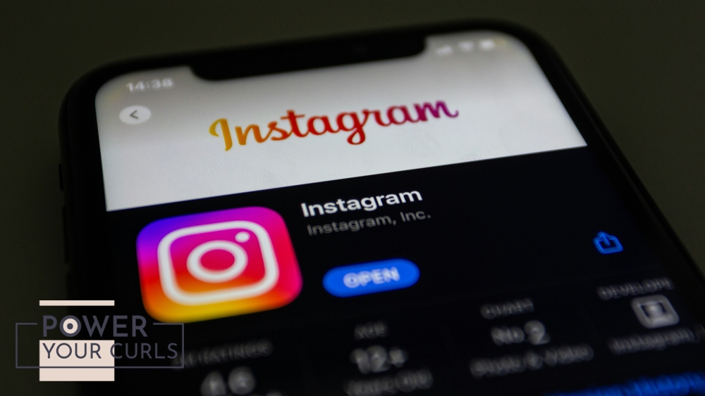 An iPhone displays the Instagram logo.