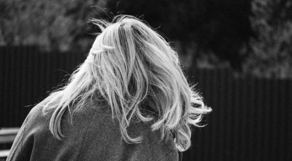 why does my hair curl at back of neck