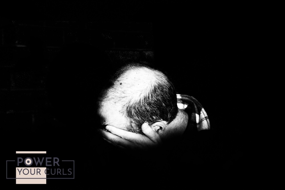 Six Effective Treatments For Hair Loss 2 A black-and-white image of the top of a man’s head. His hair appears to be thinning at the top.